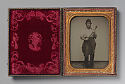 [Man Gripping Sledgehammer, Wearing Leather Half Apron and Cap], Unknown, Ambrotype with applied color