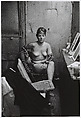 Stripper with bare breasts sitting in her dressing room, Atlantic City, N.J., Diane Arbus American, Gelatin silver print