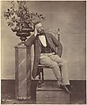 [Mathias Häusermann seated with elbow on pedestal holding a vase of flowers], Franz Antoine  Austrian, Albumen silver print from glass negative