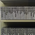 Every Shot, Every Episode, Jennifer and Kevin McCoy (American, born 1968 and 1967), Custom digital video playback installation with 277 video compact discs