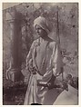 [Young Man in White Robe and Head Gear Holding Scabbard, Sicily, Italy], Wilhelm von Gloeden  Italian, born Germany, Albumen silver print from glass negative
