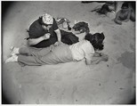 Mending, Coney Island, Weegee American, born Austria-Hungary, Gelatin silver print