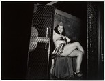 Transvestite in a Police Van, Weegee  American, born Austria-Hungary, Gelatin silver print