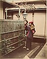 [Japanese Woman in Traditional Dress Posing with a Child on her Back], Suzuki Shin'ichi  Japanese, Albumen silver print from glass negative with applied color