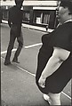 [Street Scene: Woman in Dark, Short-sleeved Dress, New York City], Leon Levinstein  American, Gelatin silver print