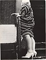 [Street Scene: Woman in Striped Dress on Stoop, New York City], Leon Levinstein  American, Gelatin silver print