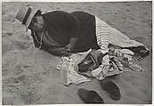 [Beach Scene: Woman Wearing Striped Hat and Dark Jacket, Coney Island, New York], Leon Levinstein (American, Buckhannon, West Virginia 1910–1988 New York), Gelatin silver print