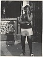 [Woman Wearing Headscarf, Tee Shirt, and Shorts, on Street at Subway Entrance, New York City], Leon Levinstein (American, Buckhannon, West Virginia 1910–1988 New York), Gelatin silver print