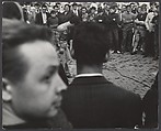 [Crowd Scene with Young Man in Chains, Portugal?], Leon Levinstein (American, Buckhannon, West Virginia 1910–1988 New York), Gelatin silver print