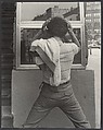 [Street Scene: Young Man Fixing Hair in Window, New York City], Leon Levinstein (American, Buckhannon, West Virginia 1910–1988 New York), Gelatin silver print