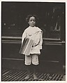 Jo Lehman, a 7 year old newsboy. 824 Third Ave., N.Y. City. He was selling in this Saloon. I asked him about the badge he was wearing.  "Oh! Dat's me bruder's," he said. Location: New York, New York., Lewis Hine  American, Gelatin silver print