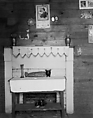 [Table, Fireplace, and Pictures on Wall of Floyd Burroughs's Bedroom, Hale County, Alabama], Walker Evans  American, Film negative