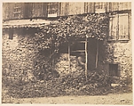 [Rustic Building with Man under Trellis], André Giroux  French, Salted paper print from glass negative