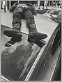 [Man Lying on Roof of Car], Leon Levinstein  American, Gelatin silver print