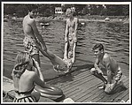 [Eastman Kodak Advertisement: Summer Lake Scene of Teenager with Camera Making a Snapshot of Her Friends in Bathing Suits on a Dock], Ralph Bartholomew Jr.  American, Gelatin silver print
