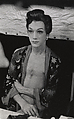 Seated female impersonator in an open kimono, Hempstead, L.I., Diane Arbus American, Gelatin silver print