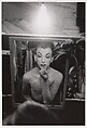 Female impersonator putting on lipstick, Hempstead, L.I., Diane Arbus American, Gelatin silver print