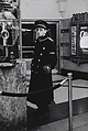 Movie theater usher standing by the box office, N.Y.C., Diane Arbus American, Gelatin silver print