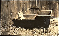 [Anita Skolle, Daughter of Hanns and Elizabeth Skolle, in Wooden Trough Before Barn Façade], Walker Evans  American, Gelatin silver print