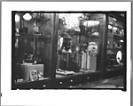 [Five 35mm Film Frames: Camera Store Window, New York City; Subway Passengers, New York City: Women Beneath 