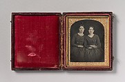 [Two Seated Young Women Identically Dressed], Unknown (American), Daguerreotype with applied color