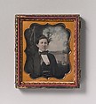 [Young Man Seated in Front of Painted Outdoor Backdrop], Unknown (American), Daguerreotype with applied color