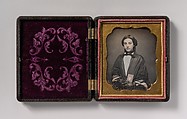 [Young Woman Wearing Lace Gloves Holding a Daguerreotype Case], Unknown (American), Daguerreotype with applied color