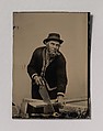 [Carpenter Sawing a Plank of Wood], Unknown (American), Tintype with applied color