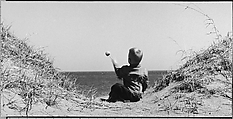 [Seated Boy on Seashore, Throwing Rock], Ralph Eugene Meatyard  American, Gelatin silver print