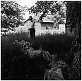 [Man in Yard, Holding Limb of Tree], Ralph Eugene Meatyard  American, Gelatin silver print