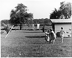 [Four Children Huddled Near Clothesline, One Standing Apart], Ralph Eugene Meatyard  American, Gelatin silver print