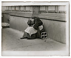 [Woman Sitting on City Sidewalk with Head in Hands], Lewis Hine  American, Lantern slide
