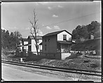 [Row of Clapboard "Company" Houses for Miners Along Railroad Tracks and Creek, Osage, West Virginia], Walker Evans  American, Film negative