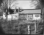 [Advertisements on Barn Façade Behind Folk Victorian House], Walker Evans  American, Film negative