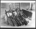 [Copy of Newspaper File Photograph: Nine Guns Propped on Bench Next to Valise, Probably Havana], Walker Evans  American, Film negative