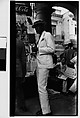 [Man in White Suit and Straw Hat in Front of Newspaper Kiosk, Havana], Walker Evans  American, Film negative