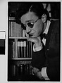 [Self-Portrait in Sunglasses Before Bookshelf, 48 Columbia Heights, Brooklyn, New York], Walker Evans  American, Film negative
