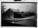 [Wooden Houses by Road with Hood in Foreground, From Automobile, Macon, Georgia], Walker Evans  American, Film negative