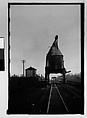 [Industrial Tower Over Railroad Tracks, From Train, Savannah, Georgia], Walker Evans  American, Film negative