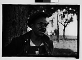 [Man Wearing Cap and Overalls Next to Tree, Hale County?, Alabama], Walker Evans  American, Film negative
