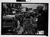 [Thirty-One 35mm Film Frames on Uncut Roll of People on Street, Including 3 of A Tintype Photographer at Work, Tallahassee, Florida], Walker Evans (American, St. Louis, Missouri 1903–1975 New Haven, Connecticut), Film negative