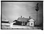 [Queen Anne House with Spindlework Porch and Gable Ornament, From Moving Automobile, Louisiana], Walker Evans  American, Film negative