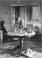 [Domestic Interior with Framed Photographs on Round Table], Nancy Naumburg  American, Gelatin silver print