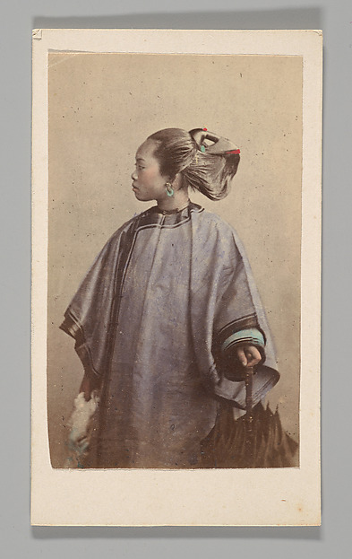 [Studio Portrait: Woman Standing in Profile Holding Umbrella, Hong Kong]