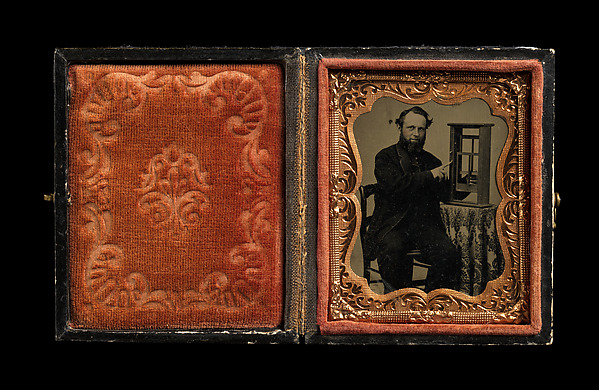 [Seated Man Demonstrating Vertical Sliding Window Model]