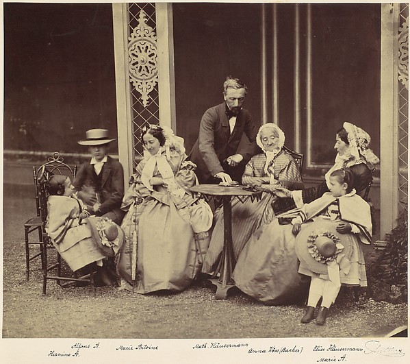 [Group Portrait of Five Adults and Two Children in a Garden]