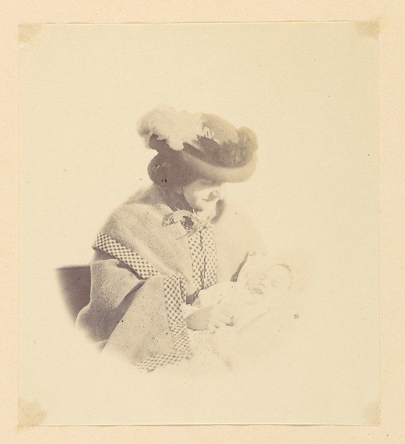 [Vignetted portrait, woman holding a baby]