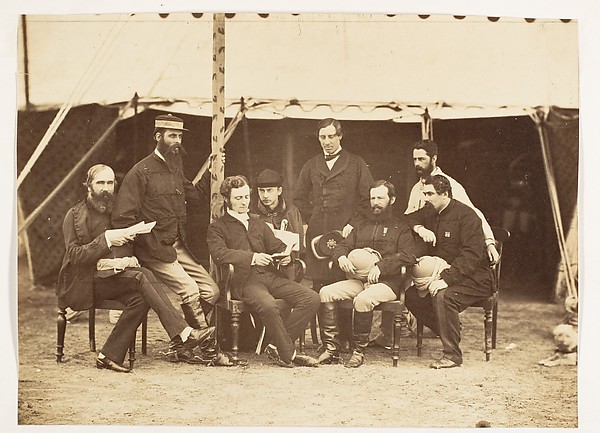 [Group Portrait: (L-R)Col.Yule P.W.D., Major Jones A.D.C., Mr. Walters, Captain Stanley A.D.C., Captain Baring A.D.C., Captain Roberts V.C.D.A.Q.M.G., Captain Hills V.C. A.D.C. and Sir E. Campbell Bart. Mry. Secry.]
