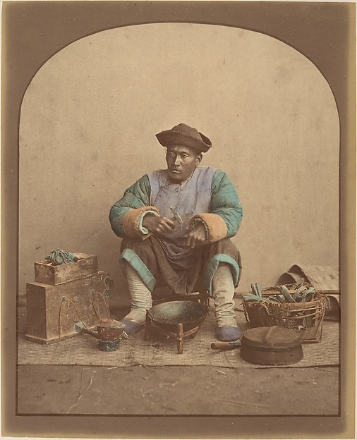 [Chinese Man Sitting with Tools]