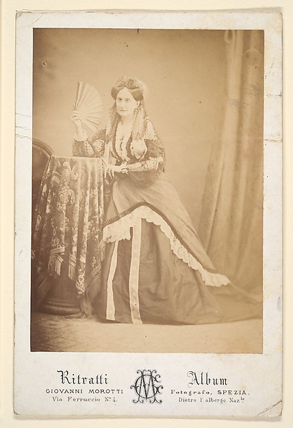 [La Comtesse at Table Holding Fan]